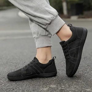 Men's black minimalist barefoot running shoes with breathable mesh and wide toe box.