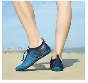 Durable blue quick-dry wading shoes worn on a sunny beach in a natural outdoor setting