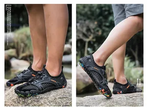 Close-up macro detail of lightweight black wading shoes for hiking and outdoor water sports