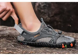 Side view detail of grey breathable mesh outdoor wading shoe with quick-lace system