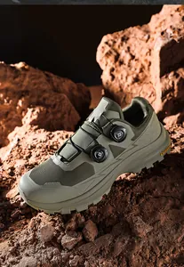 Detailed side view of waterproof olive green outdoor hiking shoes with dial lace system