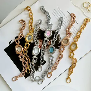 Detailed view of Scottie fashion chain watches with irregular hollow links and colored dials.