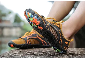 Close-up of lightweight amphibious wading shoes with non-slip colorful soles for outdoor hiking