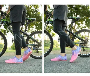 Detail of pink and purple quick-dry barefoot wading shoes worn in an outdoor cycling setting