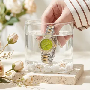 Luxury rhinestone watch with marble dial submerged in water for resistance test