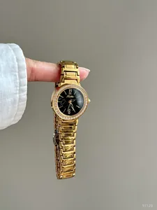 Close-up of Scottie 9712b quartz watch with marble dial and rhinestone bezel