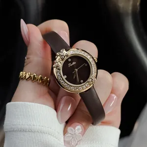 Close-up of Scottie luxury diamond-encrusted quartz watch with brown leather strap