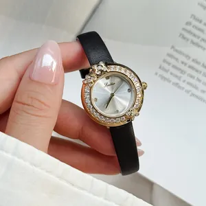 Detailed view of Scottie luxury ladies watch with floral crystal halo bezel and black leather strap
