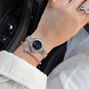 Scottie luxury women's watch with rhinestone floral bezel and silver mesh strap