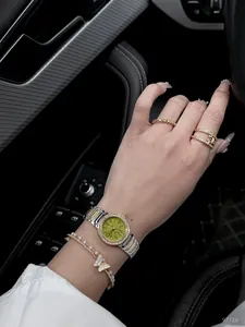 Scottie 9712b stainless steel quartz watch with green marble dial and diamond bezel