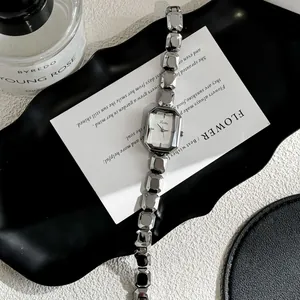 Detail of Scottie silver quartz watch with octagonal dial and faceted link bracelet