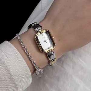 Elegant gold and silver Scottie women's quartz watch paired with diamond bracelet on wrist