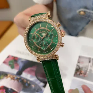 Close-up of Scottie watch with green sunray dial and rhinestone-encrusted gold bezel