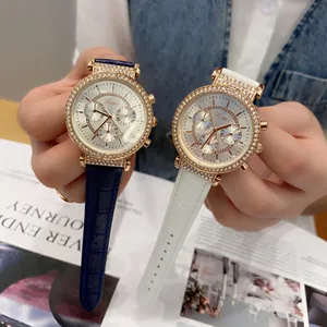 Detailed view of Scottie 9136 chronograph watches with rhinestone bezels and leather straps