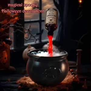 Creative spooky Halloween witch cauldron decoration with poison bottle pouring red mist