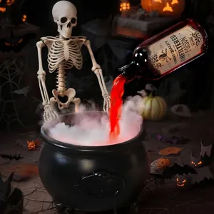 Creative Halloween witch cauldron decoration with red liquid and mystical mist effects