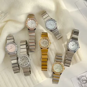 Collection of Scottie 9698 luxury diamond-set women's watches on a soft white background.