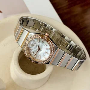 Detailed view of Scottie 9698 luxury quartz watch with diamond bezel and two-tone band