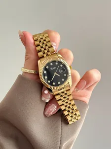 Close-up of a luxury gold ladies' quartz watch featuring a black dial and diamond markers