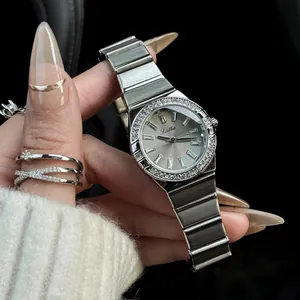 Close-up of Scottie quartz watch featuring crystal-encrusted bezel and silver link band.