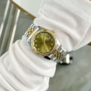 Luxury ladies quartz watch with gold-toned fluted bezel and Jubilee-style steel bracelet