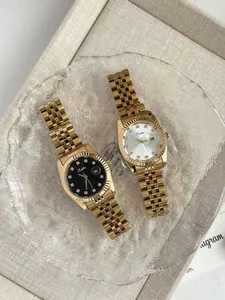 Detailed view of luxury gold Scottie women's quartz watches with black and white dials