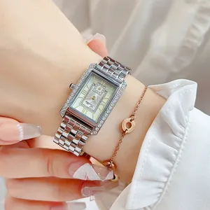 Detailed view of silver Scottie quartz watch featuring a diamond-set rectangular bezel