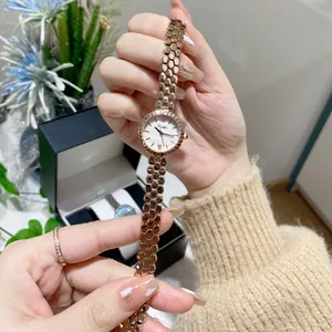 Macro detail of Scottie rose gold honeycomb strap watch with a pearl dial