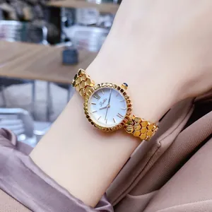 Close-up of Scottie 9615B women's watch featuring a honeycomb band and pearl dial