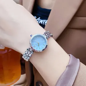 Close-up of Scottie quartz watch with blue mother-of-pearl dial and honeycomb strap.