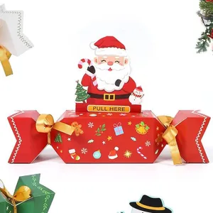 Detailed view of red Christmas candy cracker gift box with Santa pop-up pull tab feature