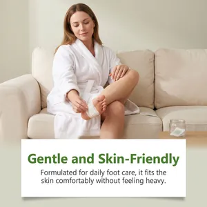 Woman applying a gentle and skin-friendly foot care patch in a cozy home setting.