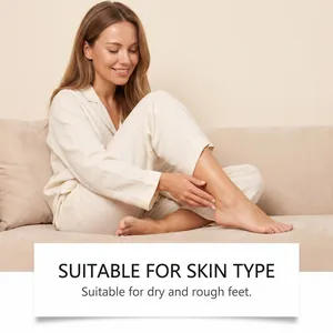 Woman applying foot care spray for dry and rough skin on a beige sofa