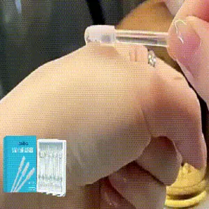 Close-up of LANISKA sticky ear cleaner showing its flexible adhesive head in use