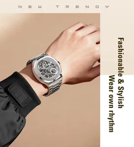 Close-up of a silver automatic mechanical skeleton watch worn on a male wrist