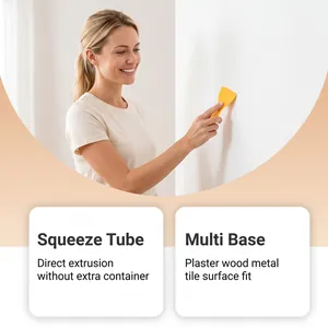 Donna che usa un raschietto giallo per applicare la pasta per riparazione pareti