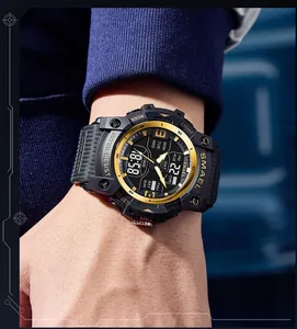 Detailed close-up of SMAEL waterproof sports watch with dual display on a male wrist.