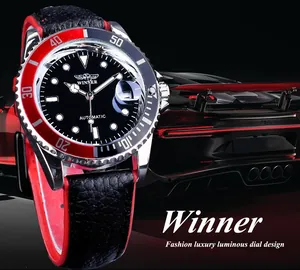 Close-up of Winner men's automatic watch with red-black bezel and luxury car background.