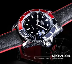 Macro detail of Winner automatic mechanical watch dial with red and black bezel