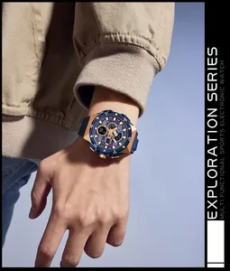 Detailed macro view of the SMAEL blue and gold sports watch on a male model's wrist
