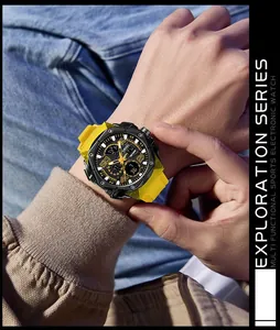 Close-up of a SMAEL yellow silicone sports watch worn on a wrist for exploration