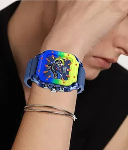 Close-up of SMAEL men's square sports watch with colorful translucent case on wrist.