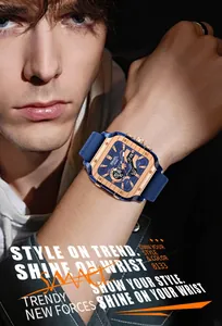 Close-up detail of SMAEL men's square rose gold sports watch with blue strap on wrist