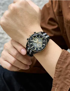 Macro view of MEGIR watch featuring black honeycomb dial and striped nylon strap