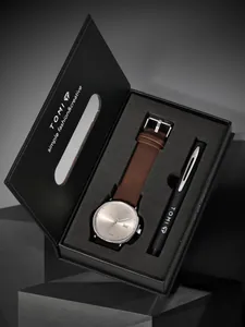 Elegantes TOMI-Geschenkset mit minimalistischer Quarzuhr und Stift in schwarzer Box.