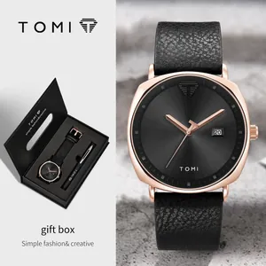 Elegantes TOMI Quarzuhren- und Stift-Set in einer hochwertigen schwarzen Geschenkbox.