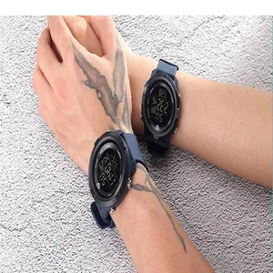Detail view of TOMI navy blue sports digital watch with large dial worn on wrist