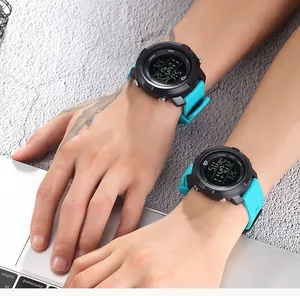 Detailed view of TOMI teal sports digital watches worn on adult and teen wrists