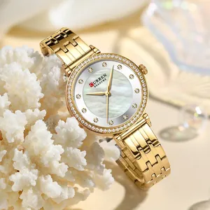 Elegante reloj de cuarzo dorado CURREN 9087 para mujer con esfera de nácar y cristales