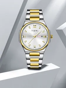 Detailed view of TOMI men's silver and gold two-tone quartz watch with luxury diamond indices